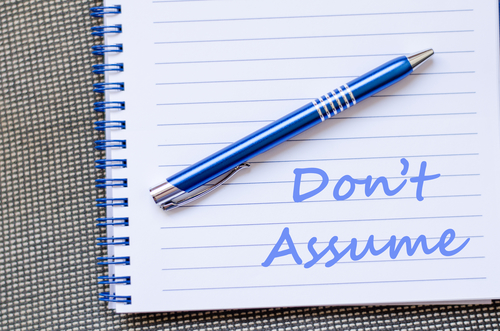 Don't assume text concept write on notebook with pen
